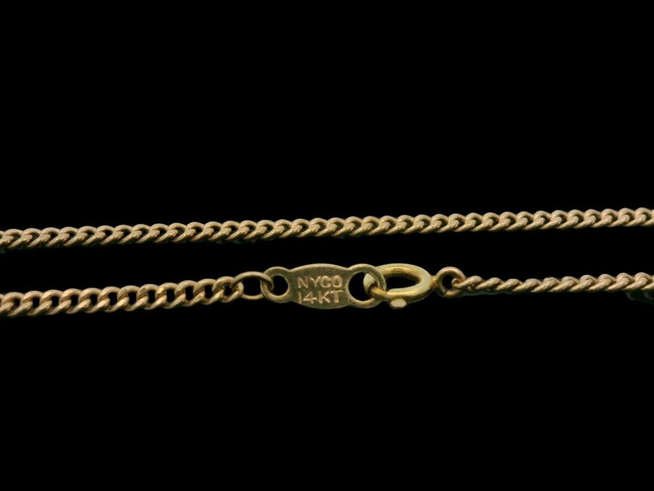 Ciondolo a sezioni simboliche in oro giallo 14k A. David, 18,5