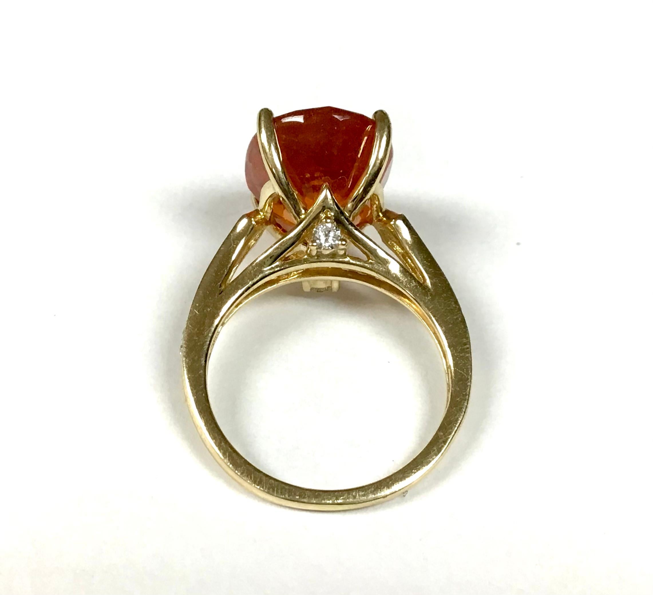  14K Yellow Gold Orange Sapphire With Diamond Ring. 
14k yellow gold oval orange sapphire and diamond ring. 5.14 Grams TW. The dimensions are approximately 
14mm x 9.5 mm. Approximately 5 carats. Approximate size 6
