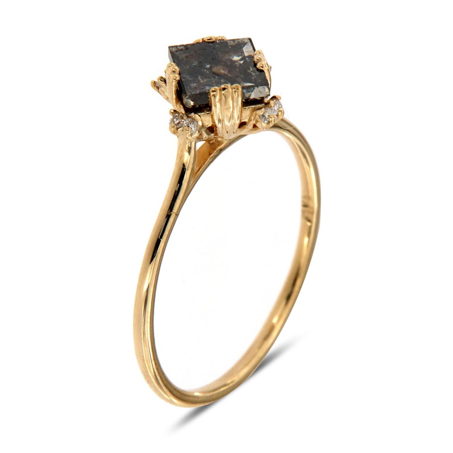 This Delicate ring features a 0.82-Carat Square Salt and Pepper Natural Diamond set in twelve (12) tiny prongs on top of a 1.2 mm band. Eight(8) brilliant round diamonds evenly scattered underneath the crown to enhance its Earthy and organic look.