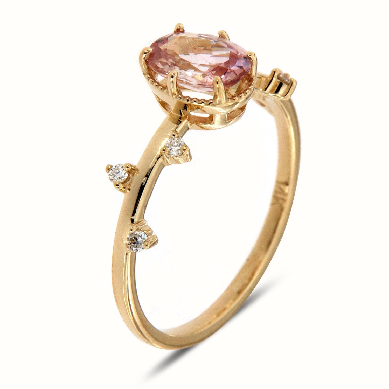 This organic design Delicate Ring features a 0.90 carat Oval shaped Peach color Unheated Sri-Lankan Sapphire set between six (6) tiny prongs surrounded by a light migrain design. Six (6) Round brilliant unevenly scattered on top of a 1.3 mm band.