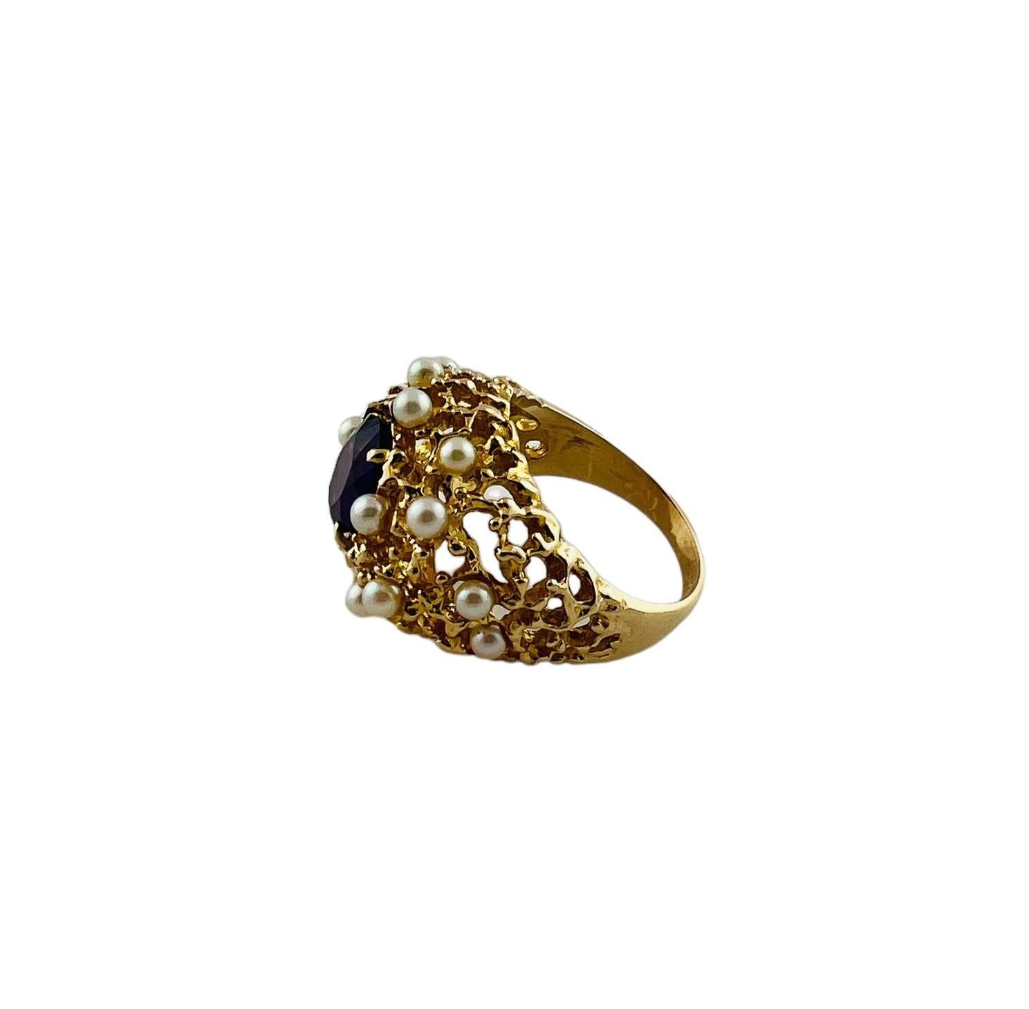 14K Yellow Gold Oval Faceted Amethyst and Pearl Ring 

This beautiful ring is set in 14K yellow gold. 

The center stone is a faceted oval purple amethyst stone surrounded by 16 small white pearls in an open dome design

Size 6.75

2.7mm