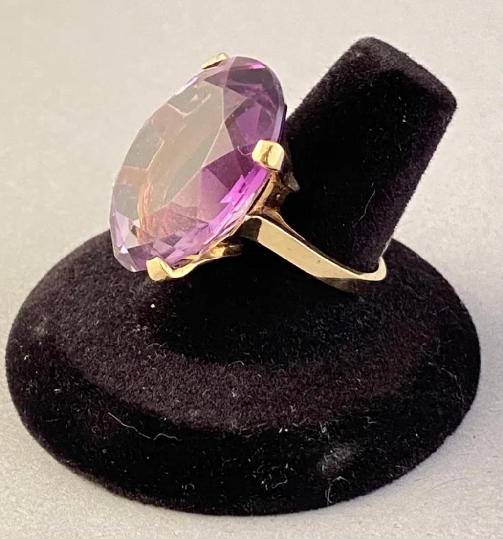 14k yellow gold amethyst ring, 11.53 Grams TW. The dimensions are approximately 20 mm x 25mm. Approximately 10-12 carats. Marked 14k. Approximate size 7.0.