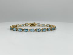 14K Yellow Gold Oval Blue Topaz Bracelet