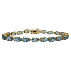 Bracciale in oro giallo 14K con Topazio Blu Ovale