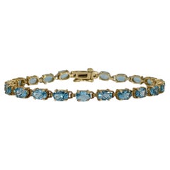 14K Yellow Gold Oval Blue Topaz Bracelet