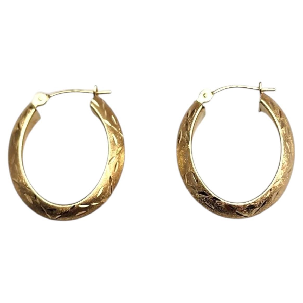 14K Yellow Gold Oval Diamond Cut Hoop Earrings #25381