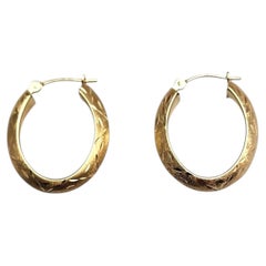 Pendientes de aro ovalados con corte de diamante, de oro amarillo de 14K #25381