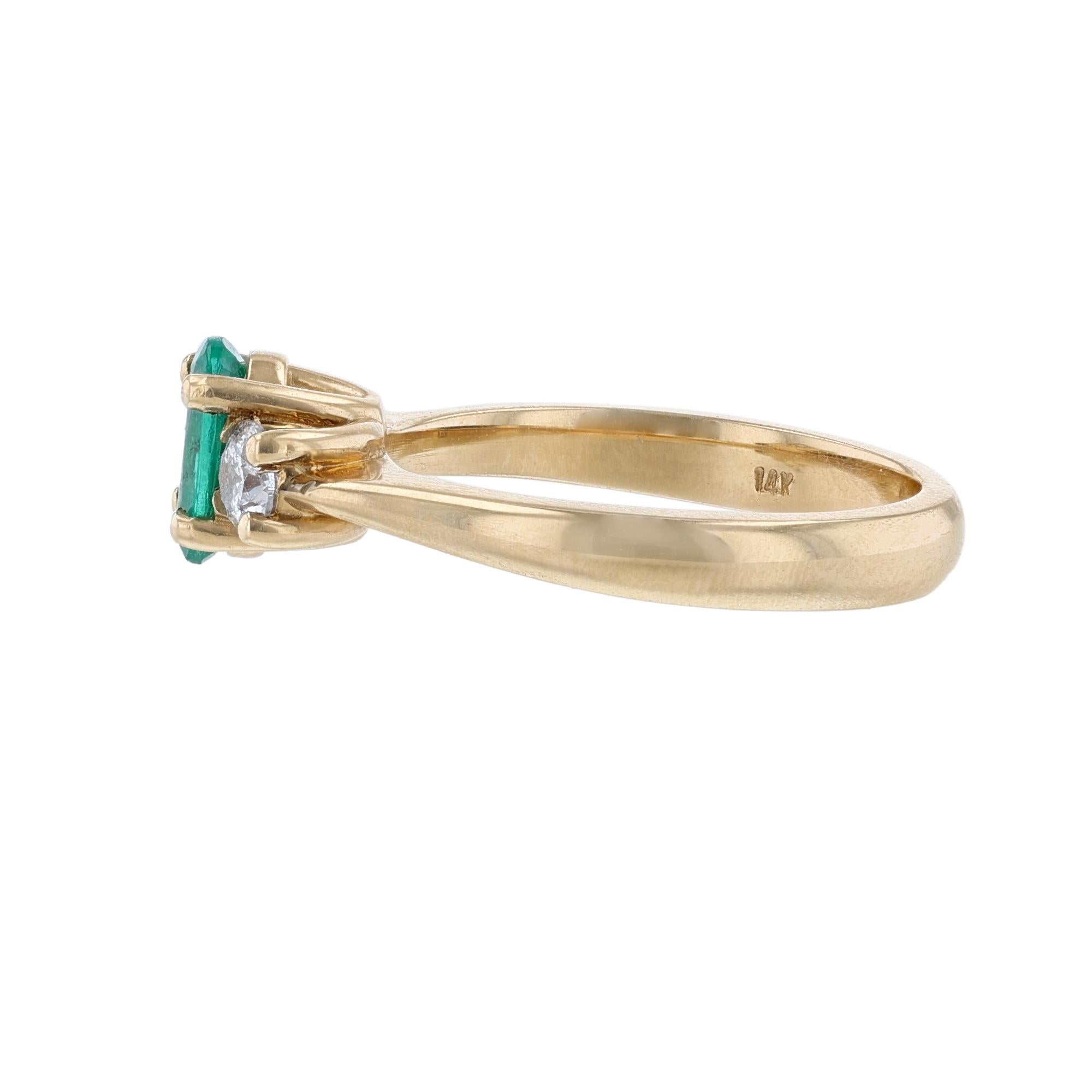 This ring is made in 14k yellow gold. It features an oval cut emerald as the middle stone weighing 0.67ct. The ring also features 2 prong set, round cut diamonds weighing 0.42cts. With a color grade (H) and clarity grade (SI2).