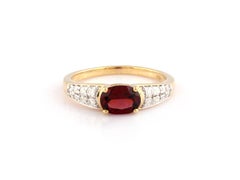 Anello da cocktail in oro giallo 14 carati con granato ovale e diamanti