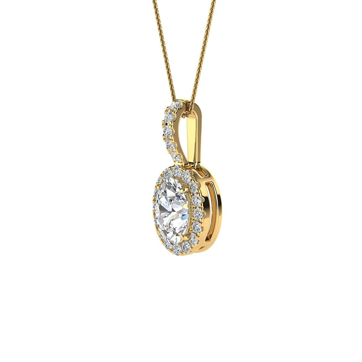 This delicate pendant features one oval-shaped diamond that is approximately 0.47-carat total weight ( 6mm x 4mm) encircled by a halo of perfectly matched 21 brilliant round diamonds in about 0.12-carat total weight. The pendant is measuring at 15