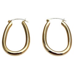 Orecchini a cerchio ovali in oro giallo 14K #25424