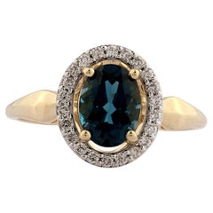 14K Yellow Gold Oval London Blue Topaz and Diamond Halo Ring