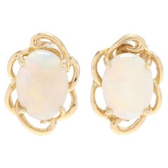 Ovale Opal-Ohrstecker 14 Karat Gelbgold mit Wellenschliff