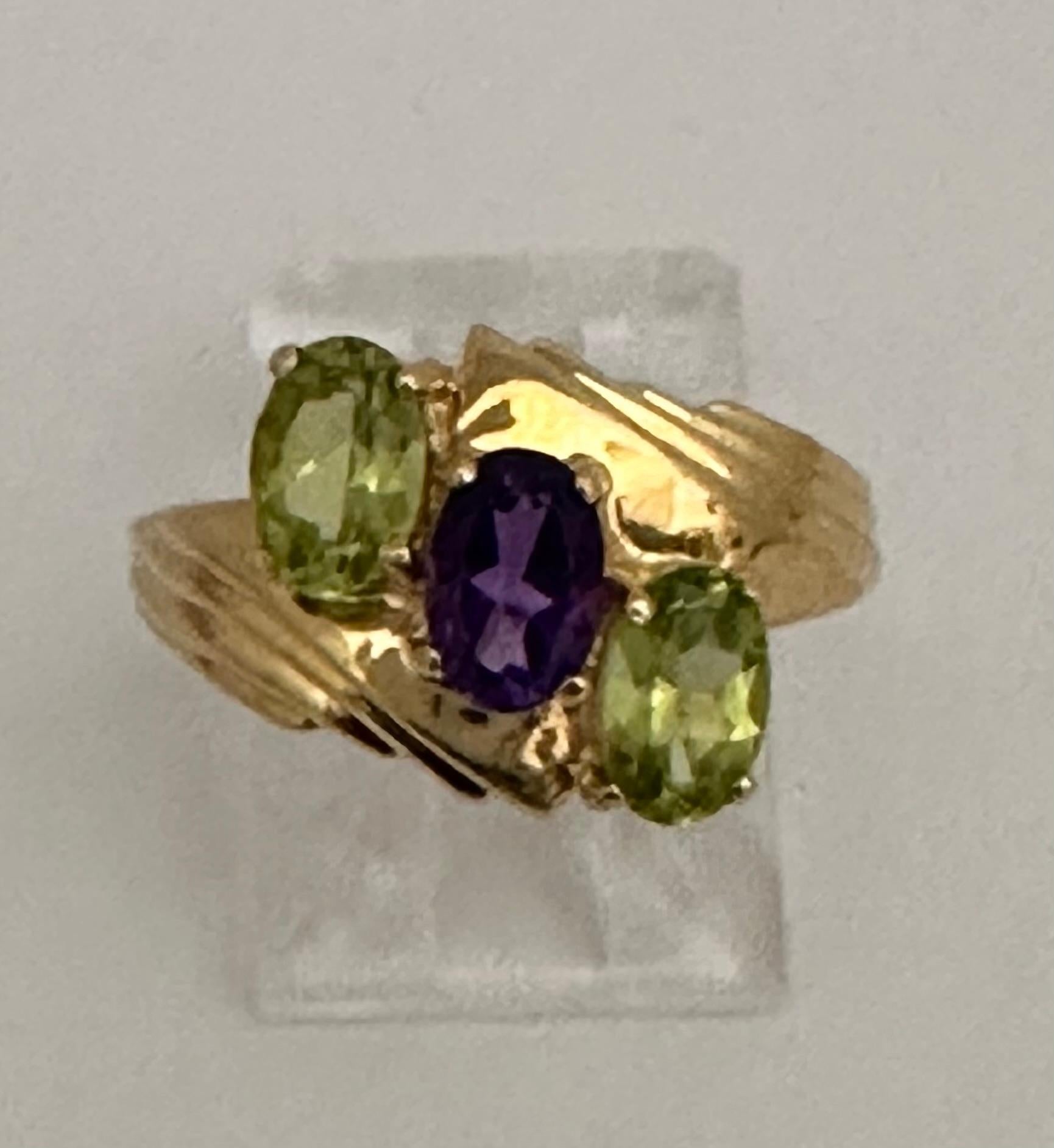 14k Yellow Gold ~ Oval ~ Peridot Amethyst ~ Ring ~ Size 6

Amethyst has been highly esteemed throughout the ages for its stunning beauty and legendary powers to stimulate, and soothe, the mind and emotions. It is a semi-precious stone in today’s