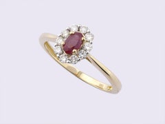 14K Yellow Gold Oval Ruby And Round Diamond Halo Ring