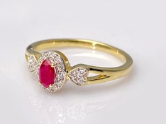 14K Yellow Gold Oval Ruby Halo Ring with Diamond Heart Accents