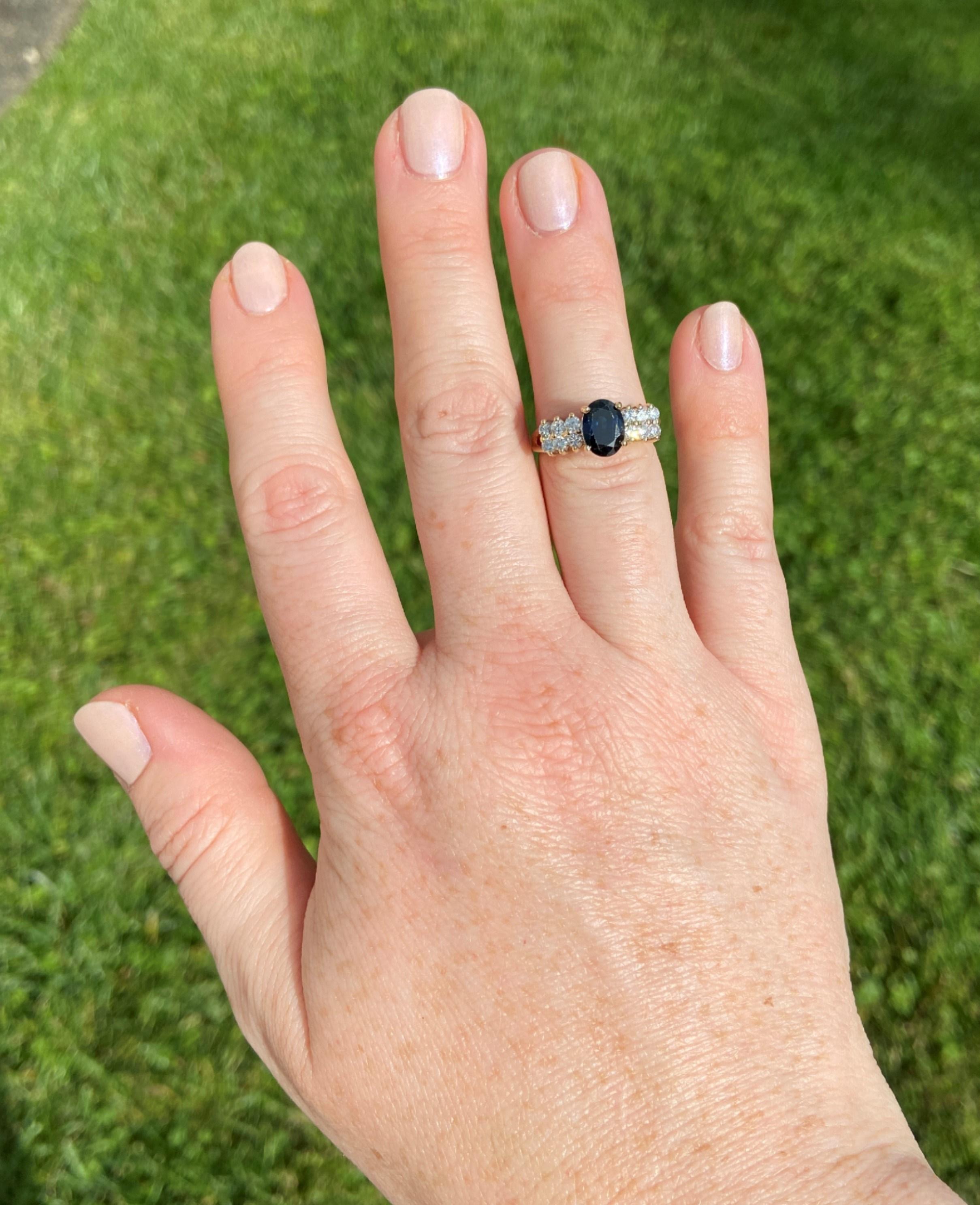 An enigmatic, deep blue 1.69ct oval sapphire sits at the pinnacle of this romantic ring. When viewed in profile, this ring reminds us of Italian footbridges over canals and romantic walks on the streets of Paris. Cobblestones of H-I color, SI2-I1