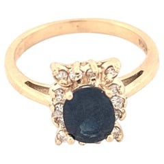 14K Yellow Gold Oval Sapphire Stone Framed by Diamonds in Scallop Edge