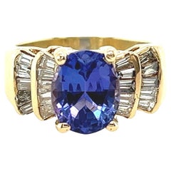 14k Yellow Gold Oval Tanzanite and Baguette Diamond Ring