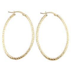 14K Yellow Gold Oval Textured Hoop Earrings #13440