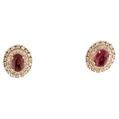 Clous d'oreilles en or jaune 14 carats avec tourmaline ovale cabochon et diamants