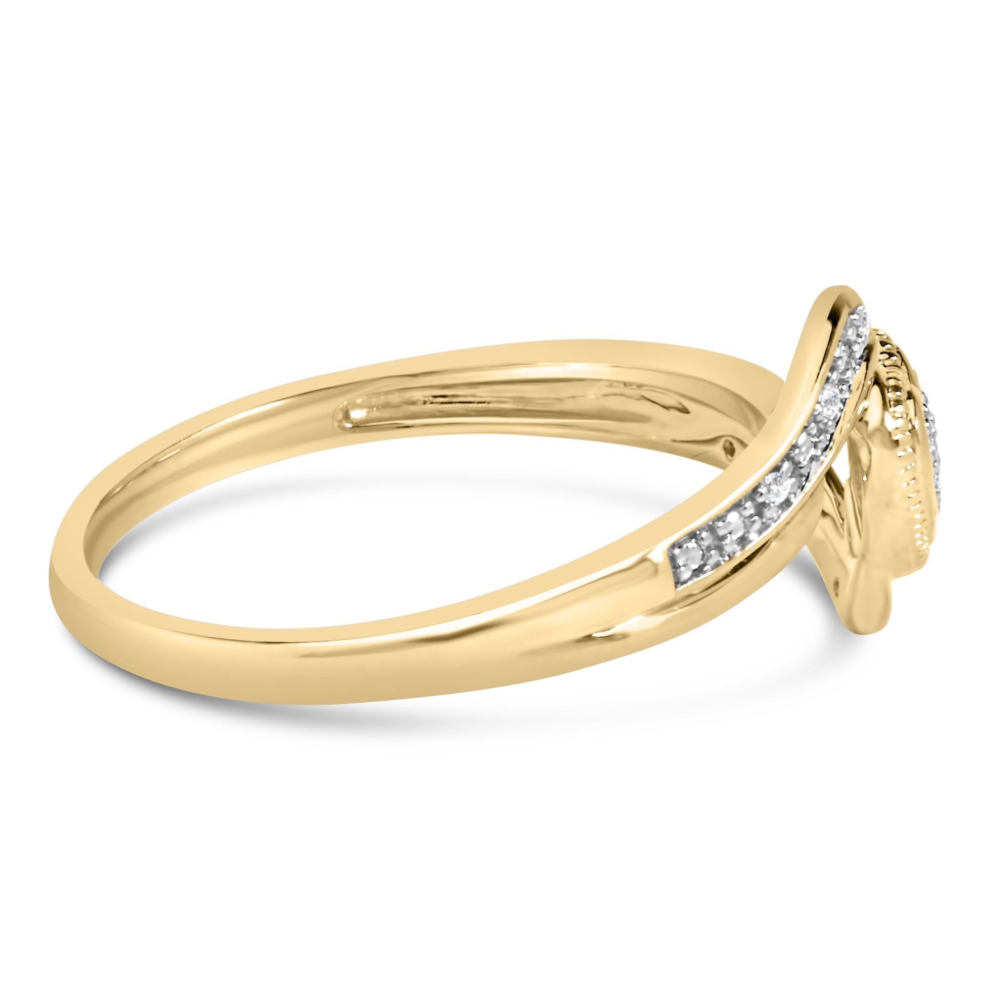 Immerse yourself in the warmth of romance and the timeless elegance with this exquisite ring, crafted from .925 sterling with a sumptuous 14K yellow gold plating. At the heart of this design lies a delicate filigree heart, meticulously detailed and