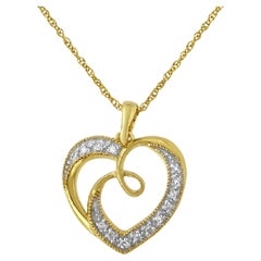 Collier pendentif cœur et ruban d'or jaune 14 carats sur argent orné de diamants