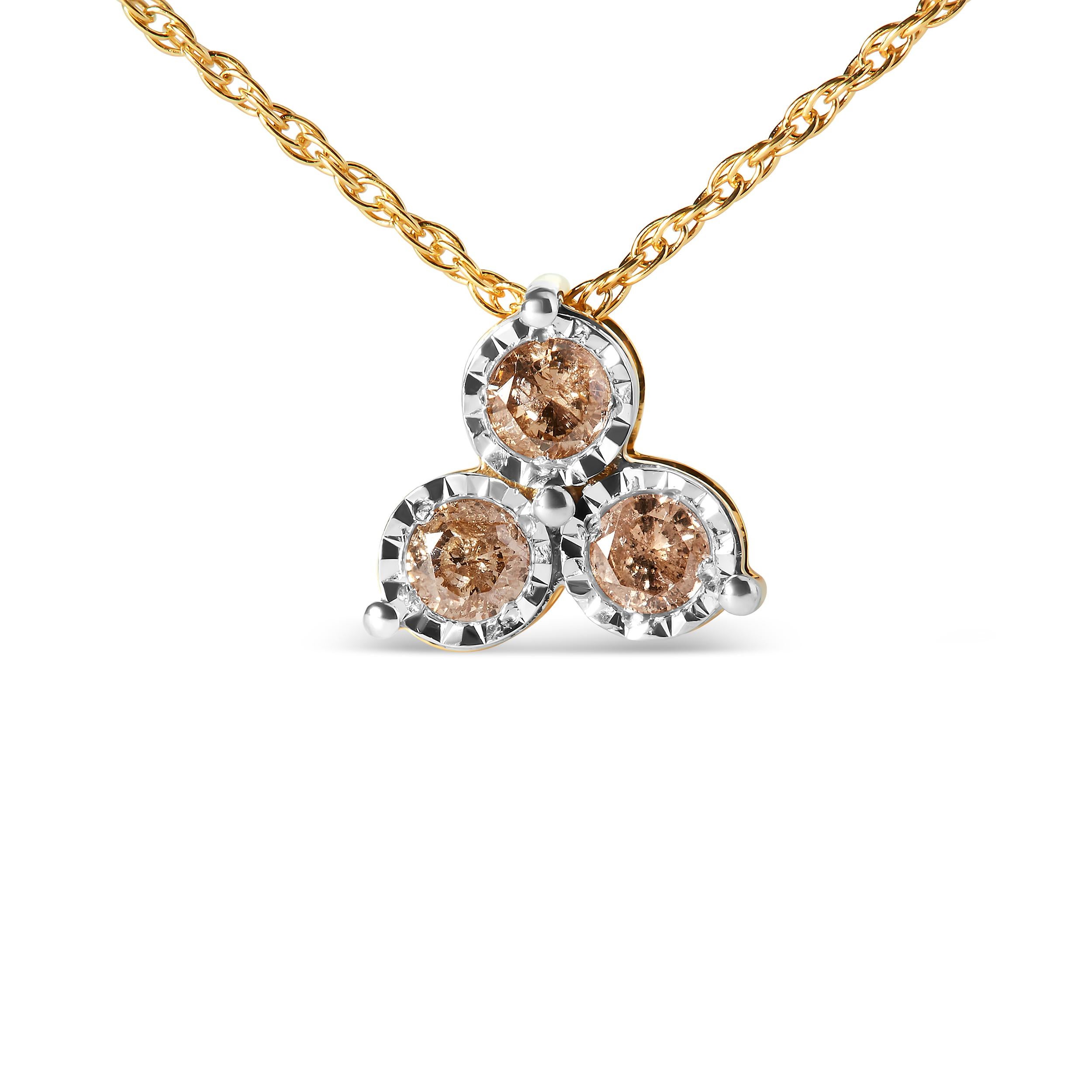 Embrace timeless elegance with our 14K yellow gold-plated .925 sterling silver pendant necklace, adorned with a trio of natural diamonds. Three round-cut diamonds, totaling 1/4 carat, dance within prong settings, exuding brilliance at every turn.