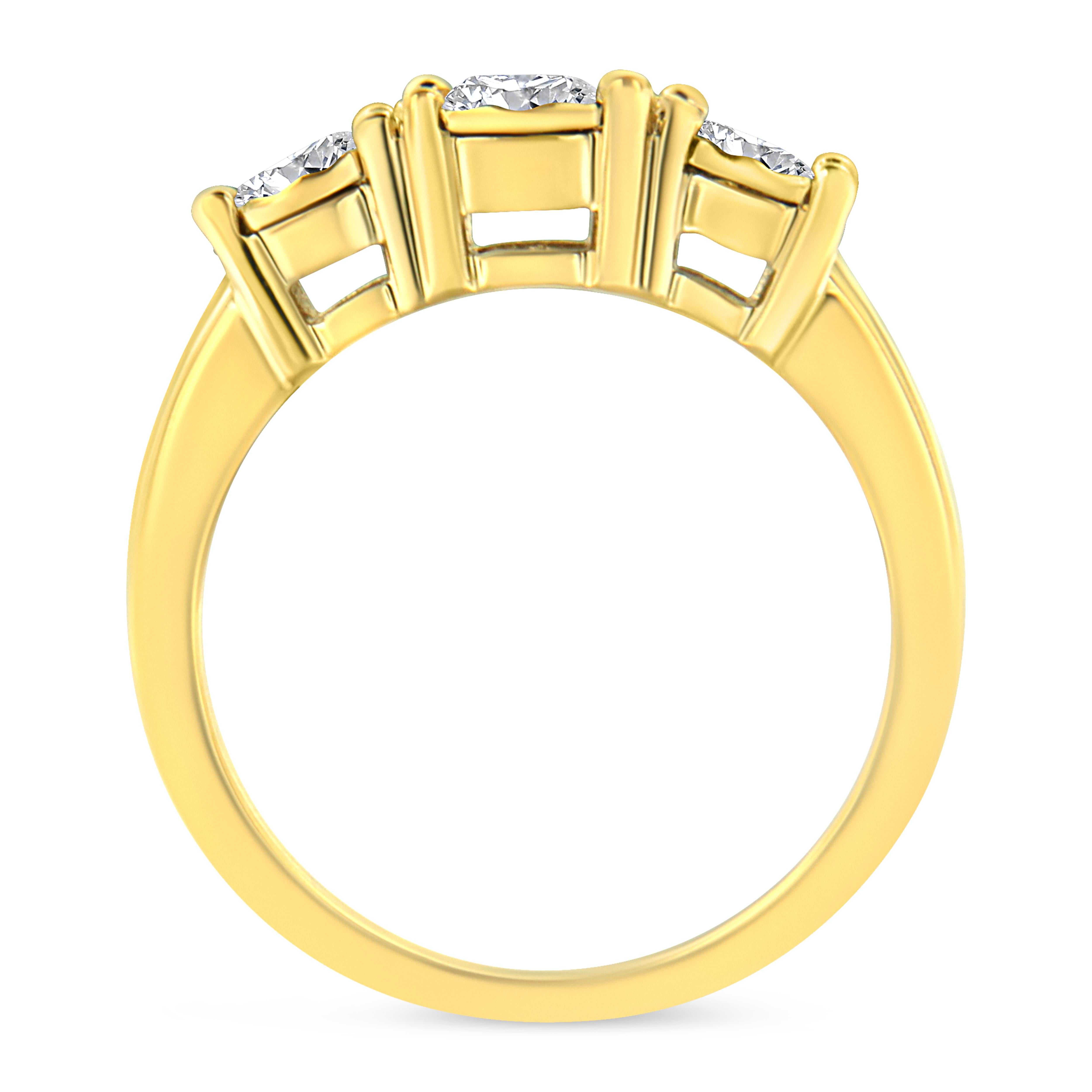Elegant and timeless, this engagement ring is reimagined with a three stone setting in beautiful, shining .925 sterling silver plated with 14k yellow gold. A round-cut diamond sits at the center of this piece, flanked by two smaller round-cut