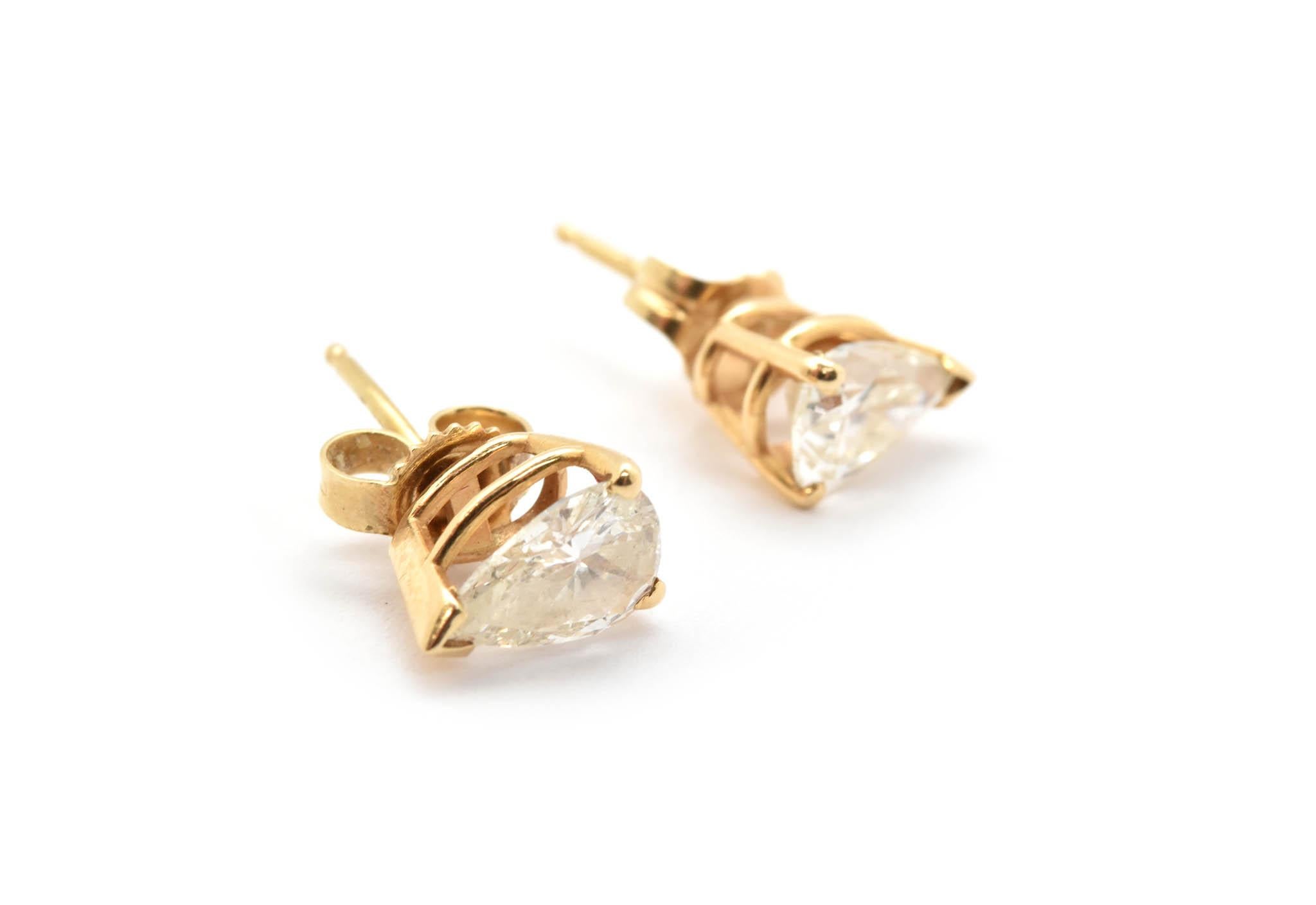 Designed in 14k yellow gold, these pear cut diamonds are set into basket settings and held into place by 3 prongs. Diamonds in these earrings are J in color and I1 in clarity. These earrings have standard posts and have secure friction backs,