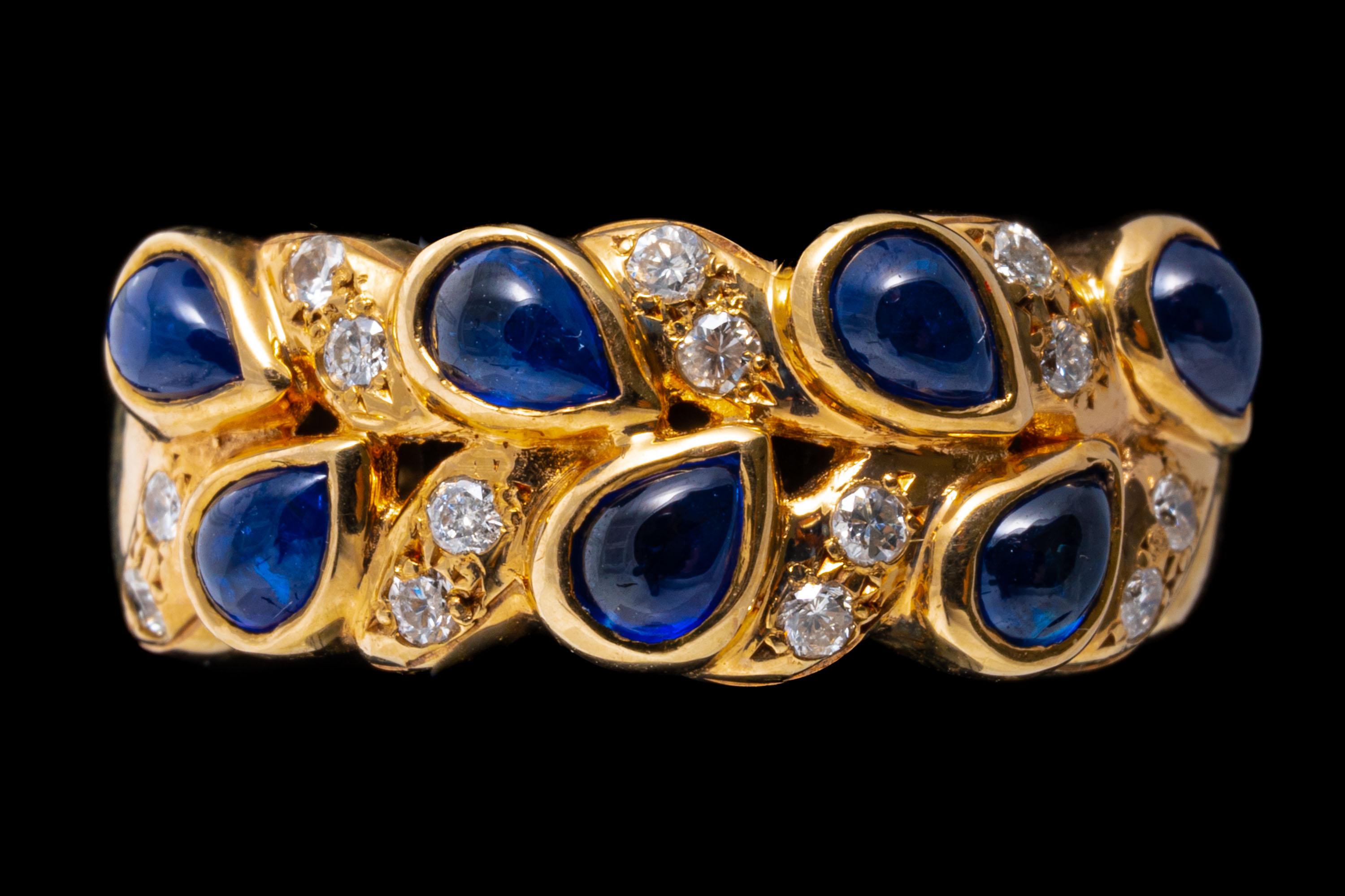 14k yellow gold ring. This handsome dome ring contains round faceted diamonds, approximately 0.14 TCW and punctuated with pear shaped cabachon cut, medium blue color sapphires, bezel set. The ring is finished by high polished shoulders.
Marks: