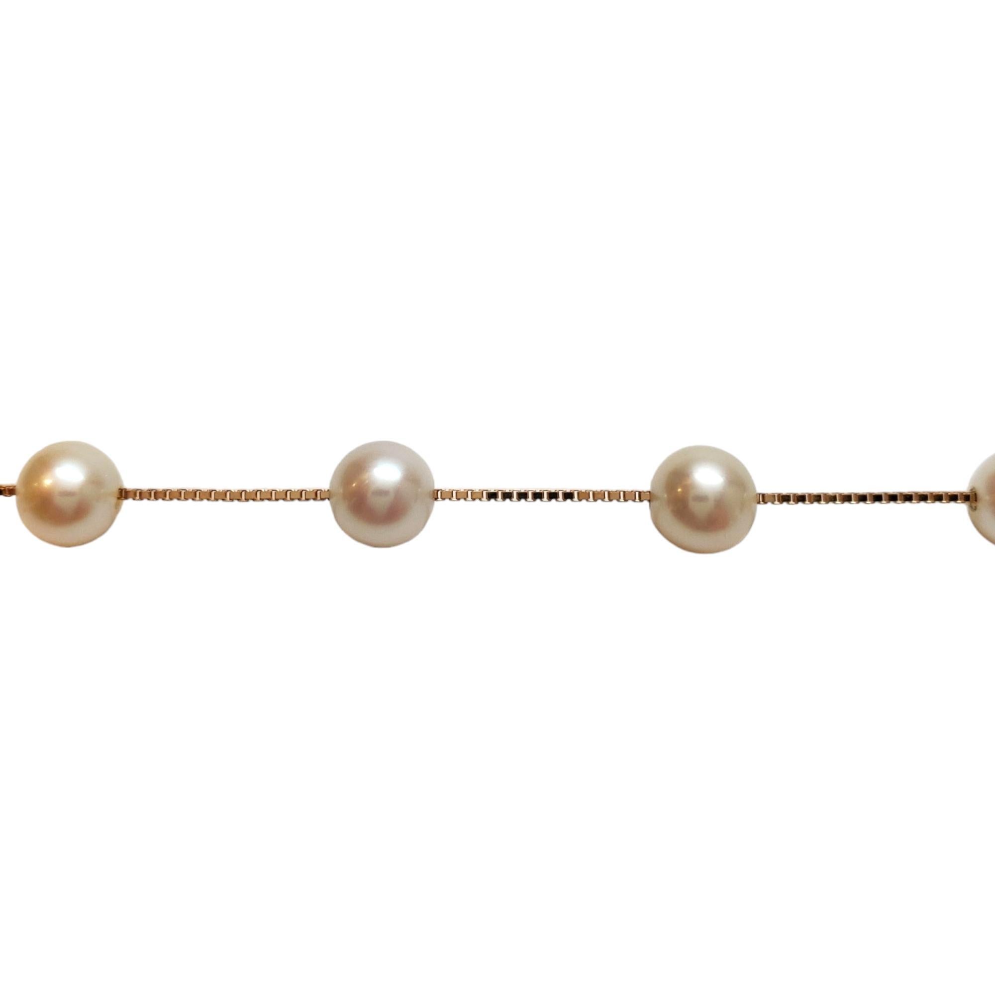 14K Yellow Gold Pearl Station Necklace 

This elegant necklace features a box chain in 14K yellow gold with 5.5-6 mm pearls.

Hallmark: 14K LPS 585

Weight: 6.67 g/ 4.29 dwt.

Chain Length: 17