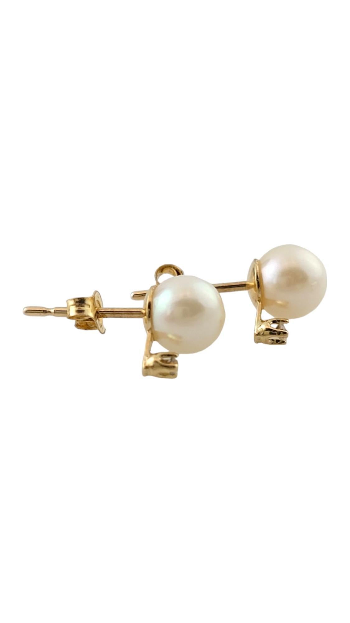 Vintage 14K Yellow Gold Pearl and Diamond Earrings

These beautiful pearl earrings also feature 2 sparkling round brilliant cut diamonds for an extra shine!

Pearls: 5.65mm each

Approximate total diamond weight: .02 cts

Diamond color: G

Diamond