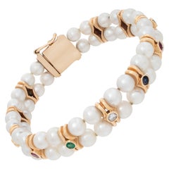 14 Karat Gelbgold Perlenarmband mit Rubinen, Diamanten, Saphiren und Smaragden