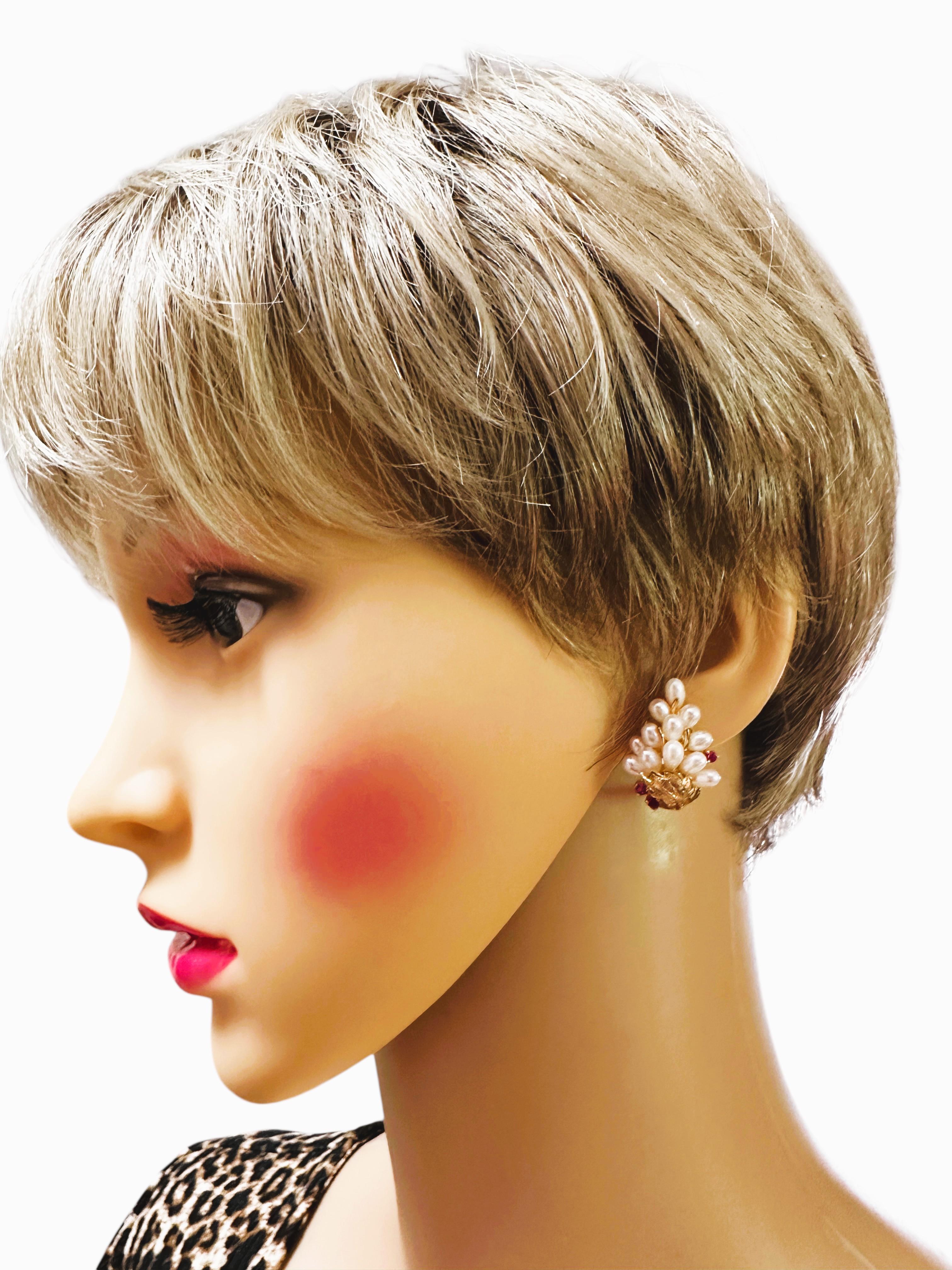 These earrings are so cool looking.  They not too big and not too small.  They are very well made and solid.  There are 13 pearls pear shaped pearls on each earring measuring approximately 5 x 3.3 mm.  And each earring has 3 diamond cut rubies that