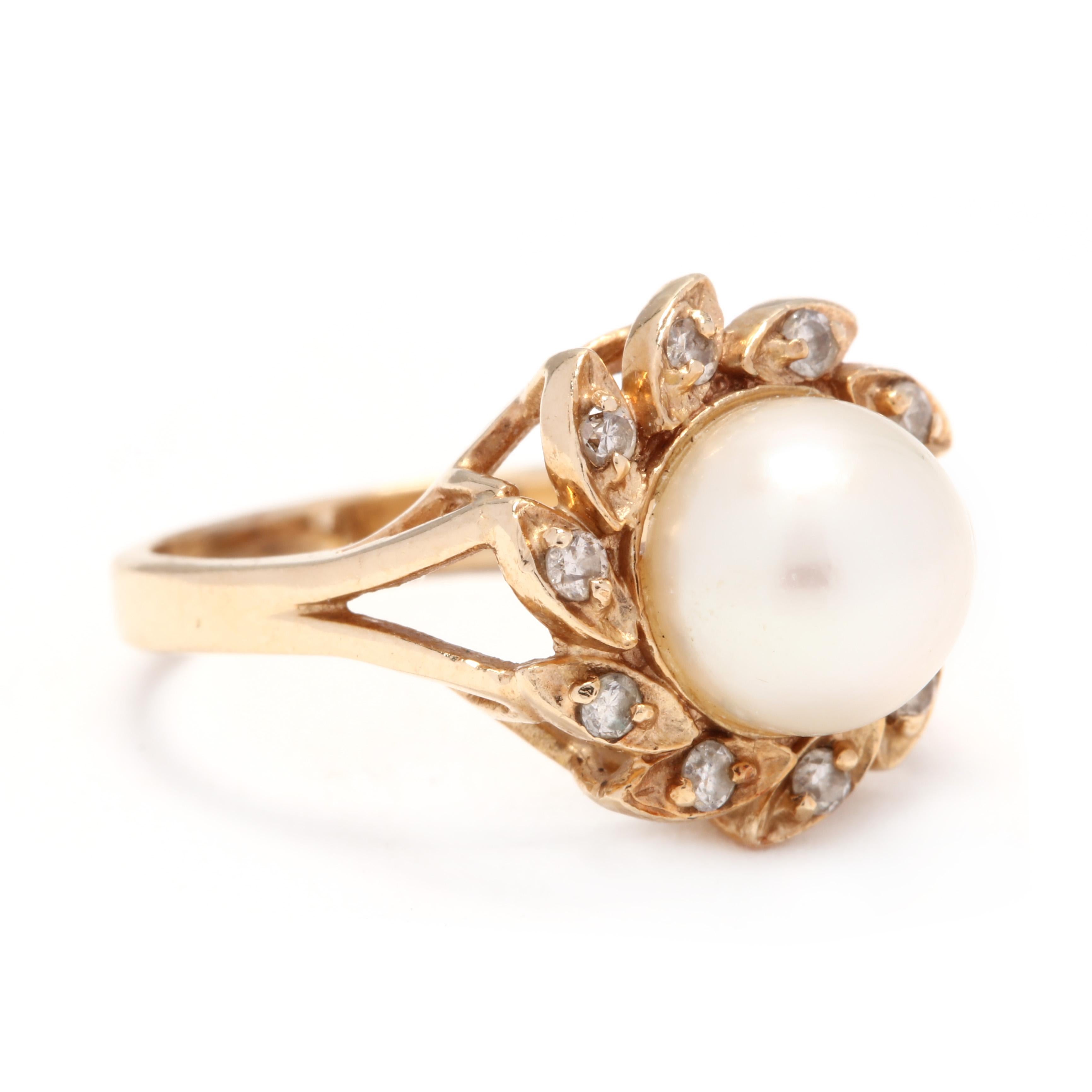 A 14 karat yellow gold, pearl and diamond statement ring. This ring features a round bead pearl (8.15 mm) surrounded by single cut round diamonds weighing approximately .15 total carats set in navette settings and with a split shank.

Stones:
-