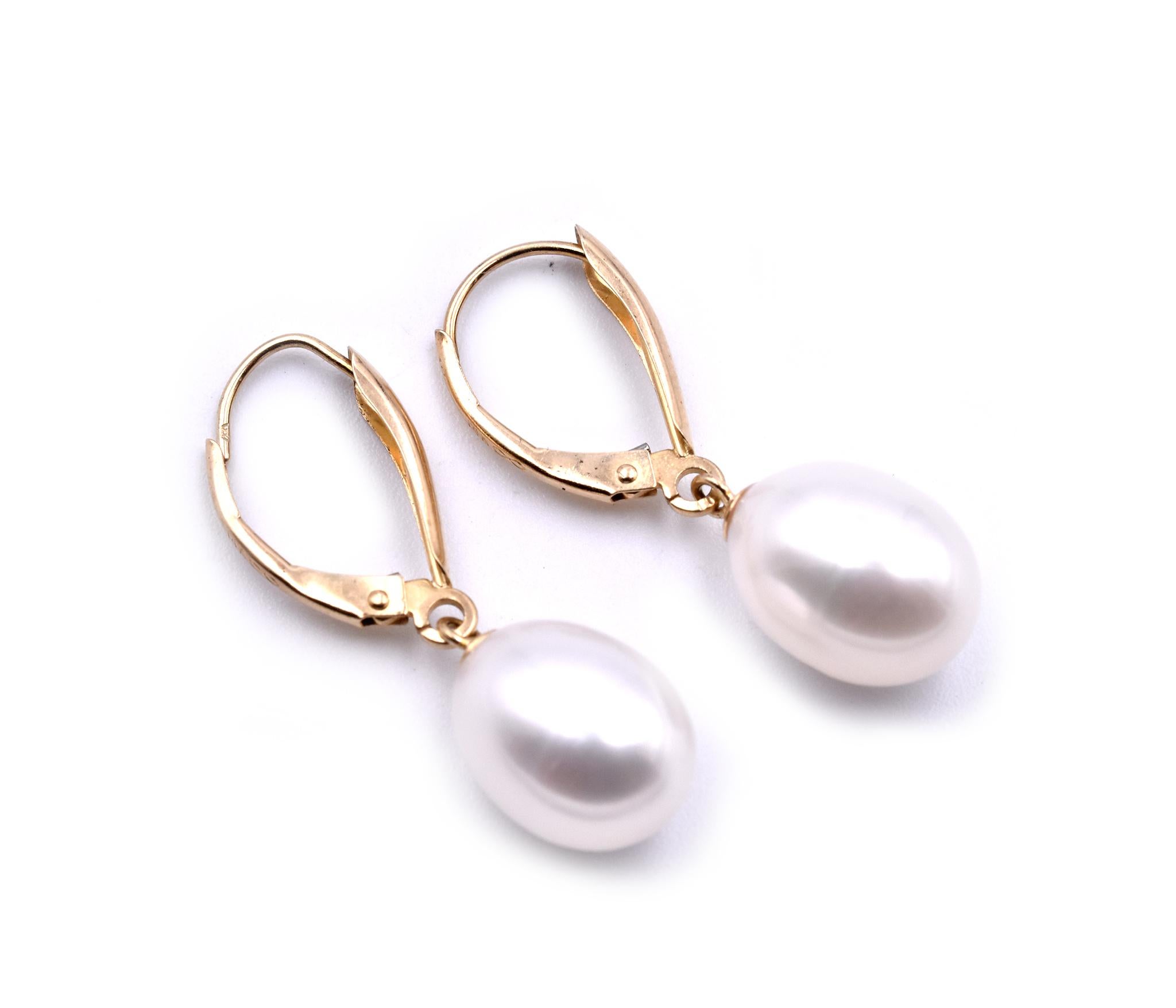 Designer: custom design
Material: 14k yellow gold
Akoya Pearls: 2 pearls approximate height is 12mm
Fastenings: French lever backs
Dimensions: earring measure approximately 30mm tall
Weight: 3.46 grams
