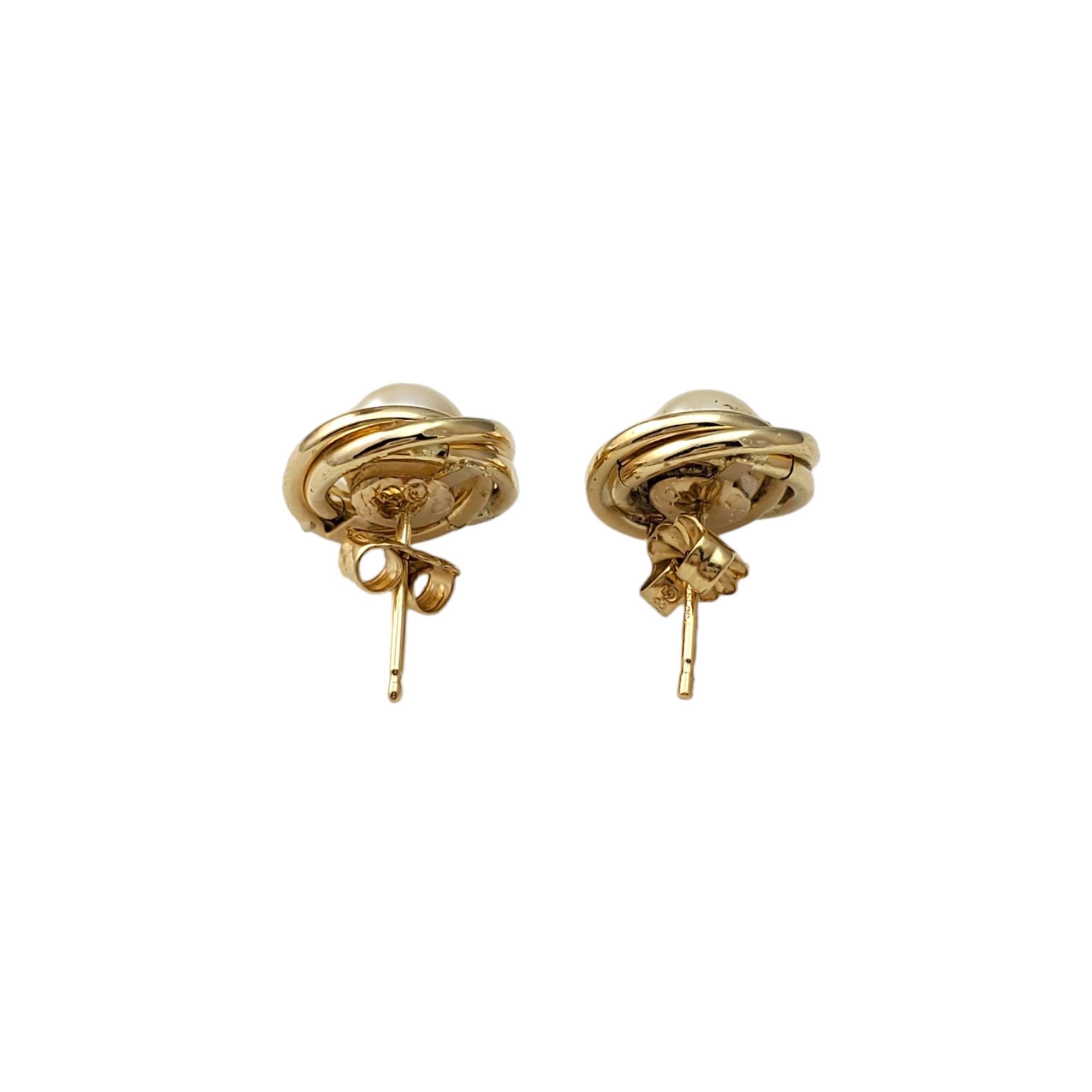 Vintage 14K Yellow Gold Pearl Earrings - 

These timeless earrings are crafted in beautifully detailed 14K yellow gold. 

Weight: 1.3 dwt/ 2.1 g

Size: 16.27mm X 11.71mm 

Hallmark: 14K 

Very good condition, professionally polished.

Will come