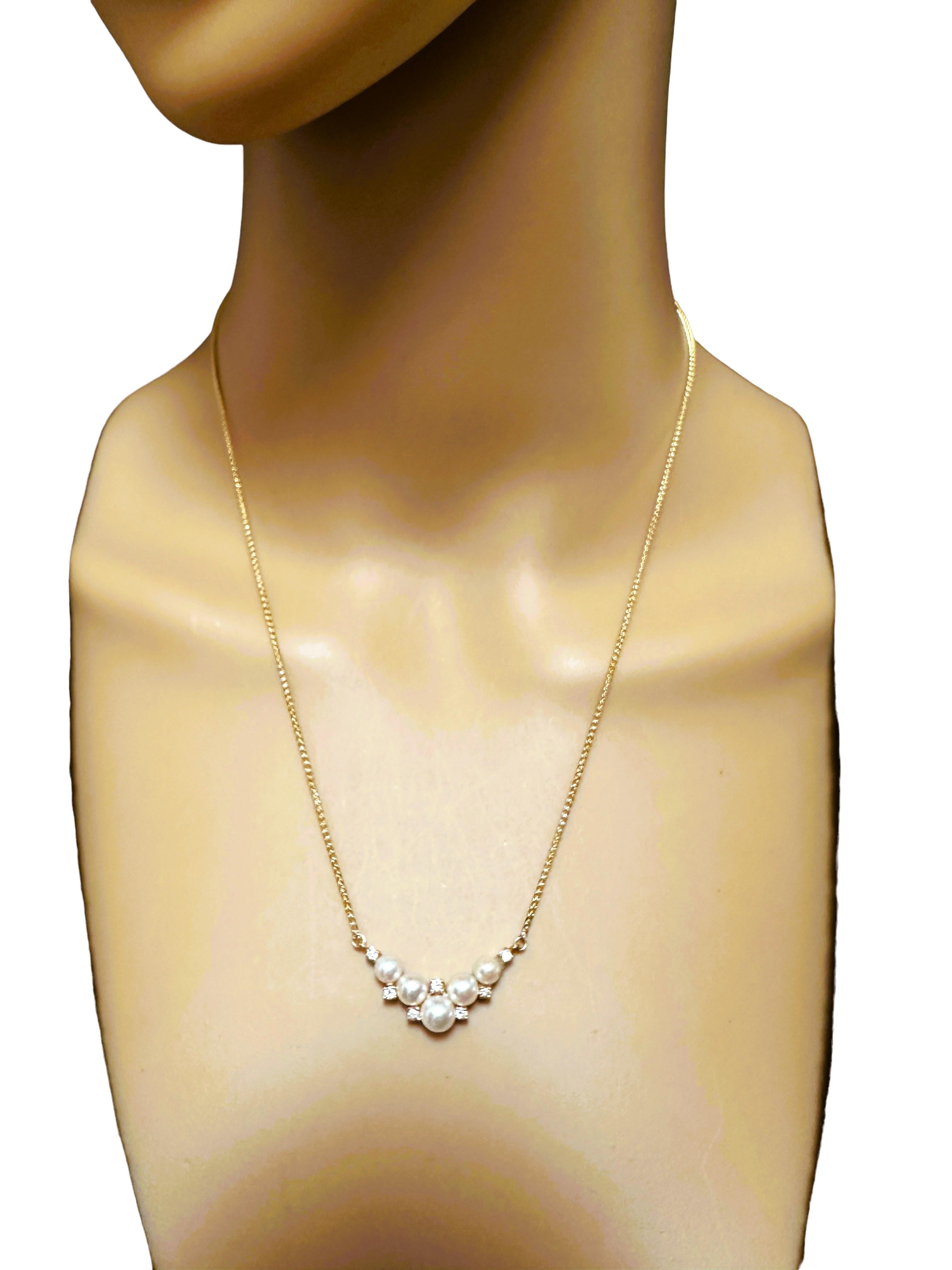 What a beautiful elegant necklace.  You can dress it up or down.  It has 5 graduated pearls, largest being 6 mm and 7 small diamonds that are approximately 2 mm round.   It is such a well constructed piece and the chain is a quality chain.    It