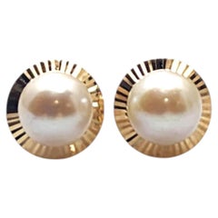 Orecchini a bottone con perla in oro giallo 14 carati #25694