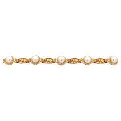 Bracciale tennis con perle in oro giallo 14k