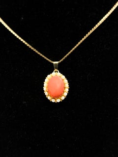 14K yellow gold pendant set with coral and pearls