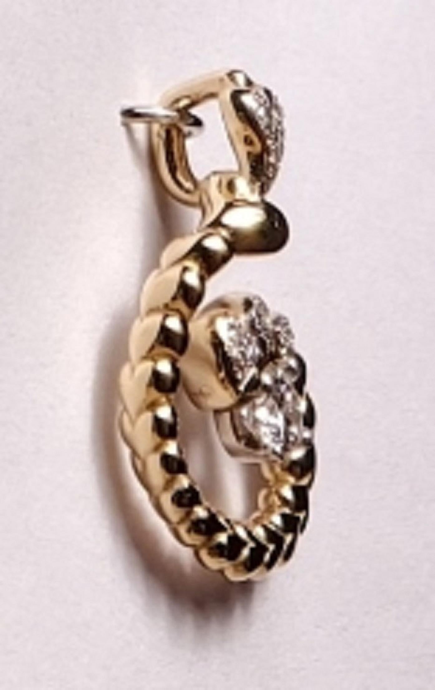 14k Yellow Gold Pendant with Diamonds are hearts that spiral around with a Flow of Love
stone: 1 round diamond .20pts.
stones: 13 diamonds .09pts.
color: G
clarity: VS
weight: .94pts.
gold: 14k
*Peggy Croft is hand wax carver of fine jewelry with