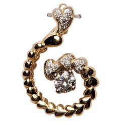 Pendentif en or jaune 14 carats avec un cœur «piraling » et une fleur d'amour en diamants