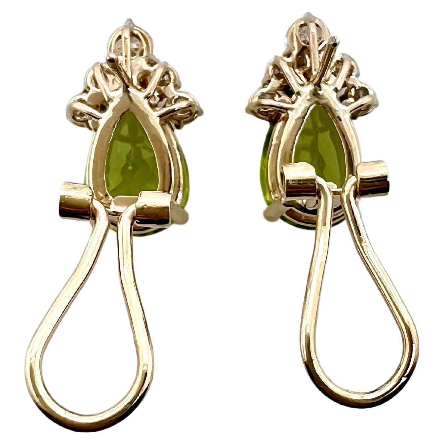 These beautiful, pear shaped peridot earrings are tastefully done.  The top apex are lined with round diamonds and
have a french clip backing.  The beautiful lime green color has a vibrant pop and will stand out nicely on the ears.  Its
the perfect