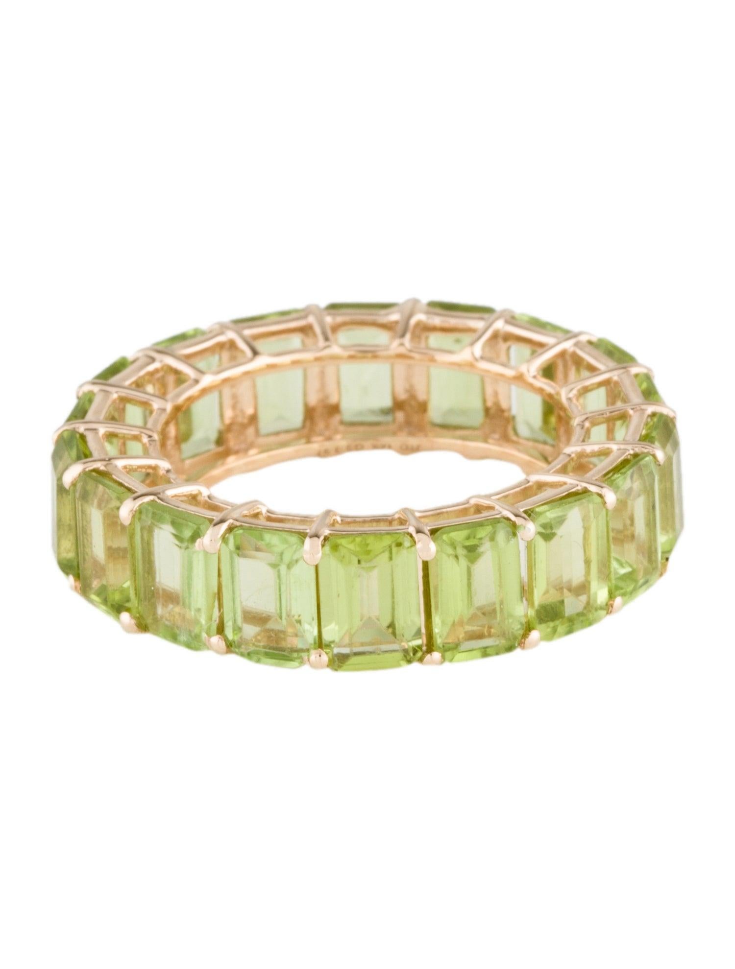 Introducing our stunning 14K Yellow Gold Peridot Eternity Band, a true celebration of timeless elegance and vibrant beauty. Sized at 7, this exquisite ring is adorned with a continuous circle of cut cornered rectangular step cut peridots, each