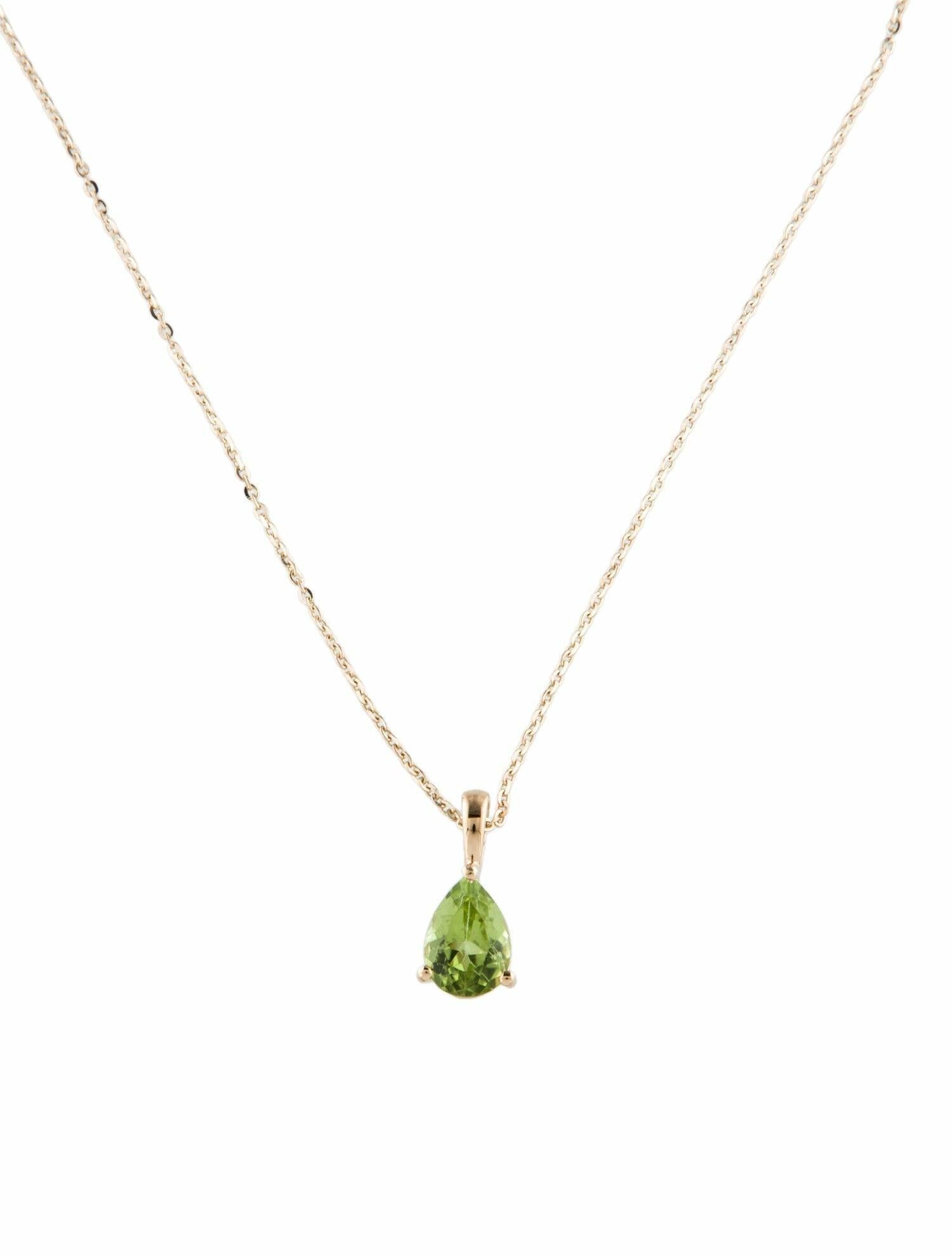 Discover the elegance and allure of this 14K Yellow Gold Peridot Pendant Necklace, a fine jewelry piece that marries classic sophistication with modern design. Perfect for those who appreciate the beauty of natural gemstones, this pendant features a