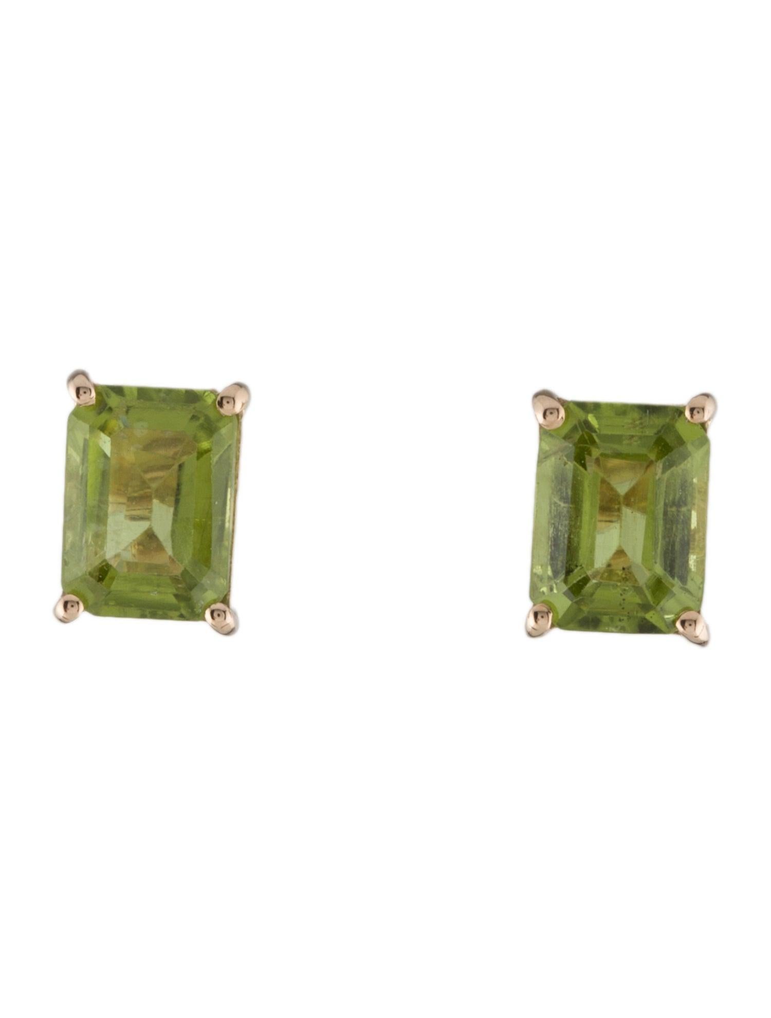 Discover the captivating allure of our 14K Yellow Gold Peridot Stud Earrings, featuring a total of 3.21 carats of cut cornered rectangular step cut peridots. Set in the timeless elegance of 14K yellow gold, these earrings showcase vibrant green
