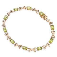 Bracelet de tennis en or jaune 14k à péridot