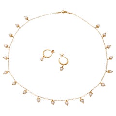 Collana e orecchini in oro giallo 14k con perle a forma di petalo